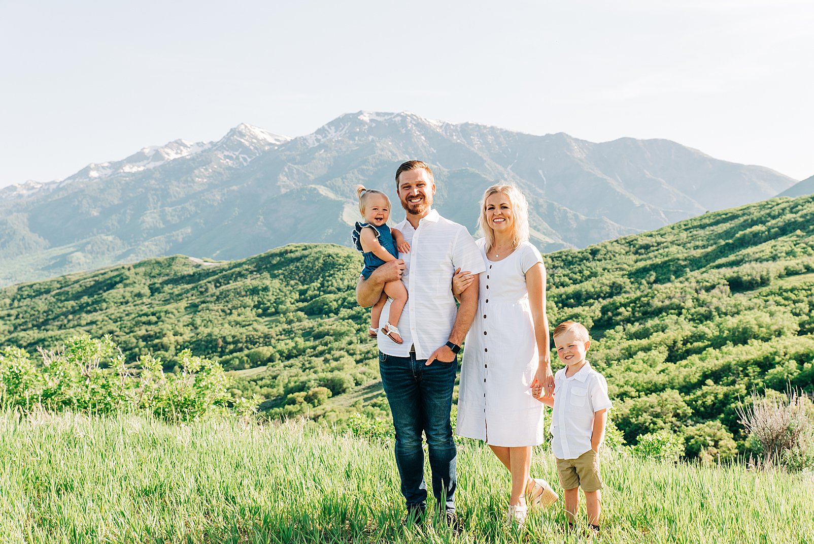 summer family pictures green mountain background white outfits